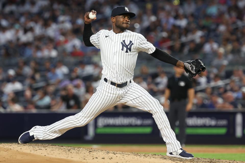 Jul 31, 2023; Bronx, New York, USA; New York Yankees starting pitcher Domingo German (0) delivers a pitch during the seventh inning against the Tampa Bay Rays at Yankee Stadium. Mandatory Credit: Vincent Carchietta-USA TODAY Sports