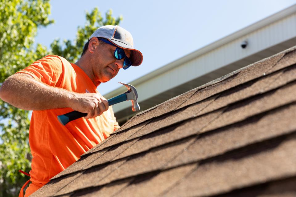 Doug Mittrucker works on a shed at Freedom Landing in Salt Lake City on Wednesday, July 12, 2023. The Home Depot Foundation, in partnership with the Housing Authority of Salt Lake City, renovated two permanent housing facilities on Wednesday meant for homeless veterans, individuals with disabilities and the chronically homeless. | Megan Nielsen, Deseret News