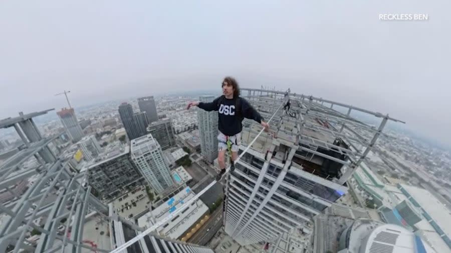 YouTube daredevil and performance artist Ben Schneider is seen walking a small rope tied between two skyscrapers in downtown Los Angeles on May 12, 2024. (Ben Schneider)