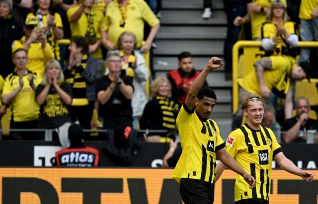 <a class="link " href="https://sports.yahoo.com/soccer/teams/borussia-dortmund/" data-i13n="sec:content-canvas;subsec:anchor_text;elm:context_link" data-ylk="slk:Dortmund;sec:content-canvas;subsec:anchor_text;elm:context_link;itc:0">Dortmund</a> forward Sebastien Haller scored two goals and had a hand in two more in a thumping win over Gladbach