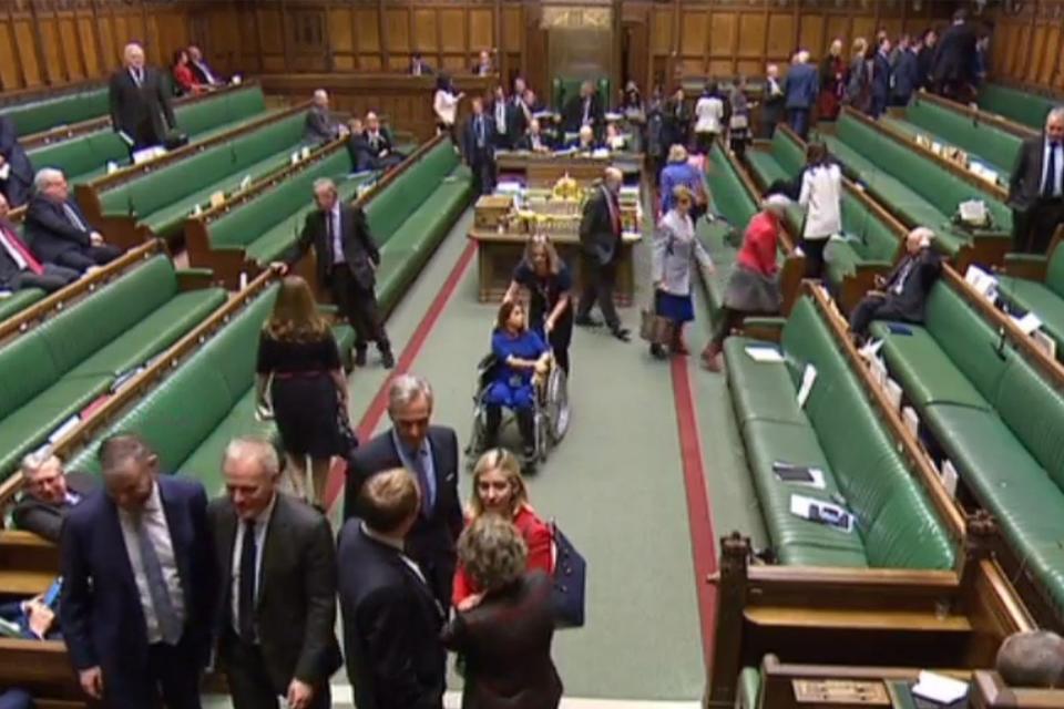 Labour Party MP Tulip Siddiq being pushed in a wheelchair in the House of Commons (AFP/Getty Images)