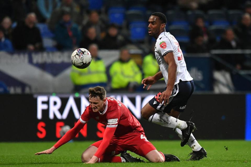 Cameron Jerome in action against Shrewsbury's Joe Anderson on Tuesday night <i>(Image: Camerasport)</i>