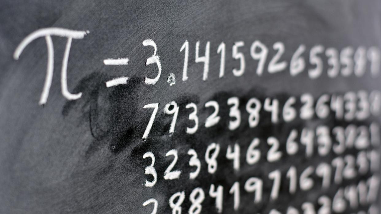  The number pi written out on a blackboard. 