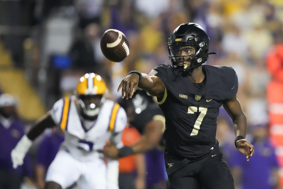 Army quarterback Champ Harris (7) pitches on a lateral in the first half of an NCAA college football game against LSU in Baton Rouge, La., Saturday, Oct. 21, 2023. (AP Photo/Gerald Herbert)