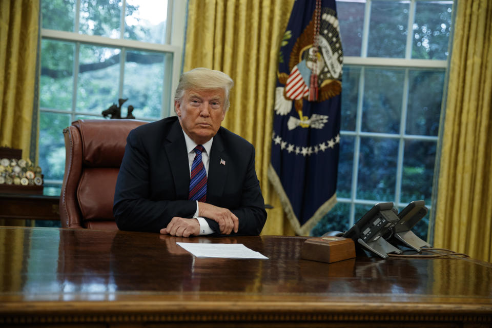 President Trump listens during a phone call in the Oval Office with Mexican President Enrique Peña Nieto about a trade agreement between the United States and Mexico, Aug. 27, 2018. (AP Photo/Evan Vucci)