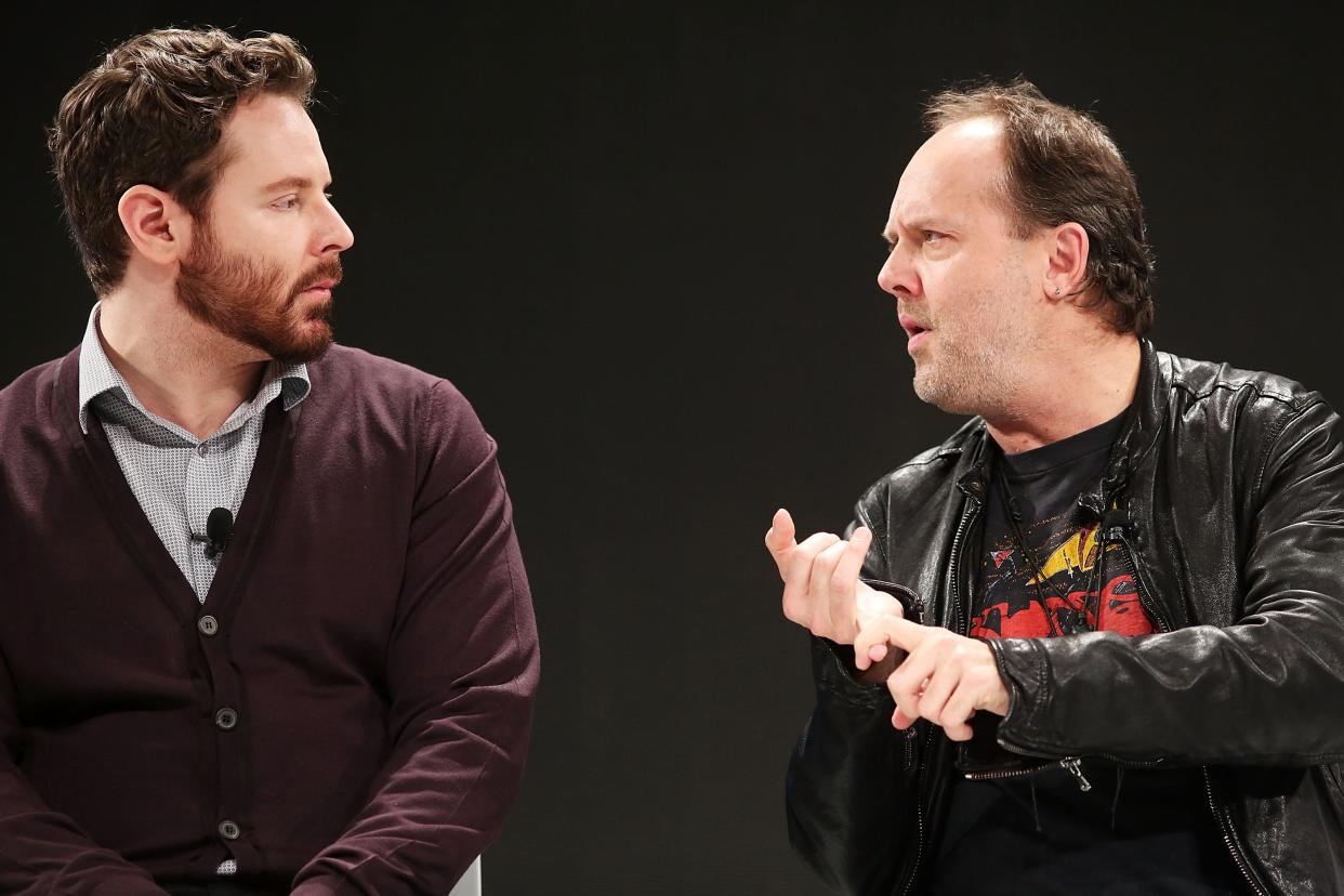 Napster co-founder Sean Parker (L) speaks with Metallica drummer Lars Ulrich at a Spotify event on December 6, 2012 in New York City.