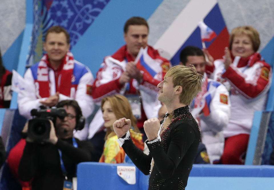 Evgeni Plushenko of Russia celebrates after competing in the the men's team short program figure skating competition at the Iceberg Skating Palace during the 2014 Winter Olympics, Thursday, Feb. 6, 2014, in Sochi, Russia. (AP Photo/Bernat Armangue)