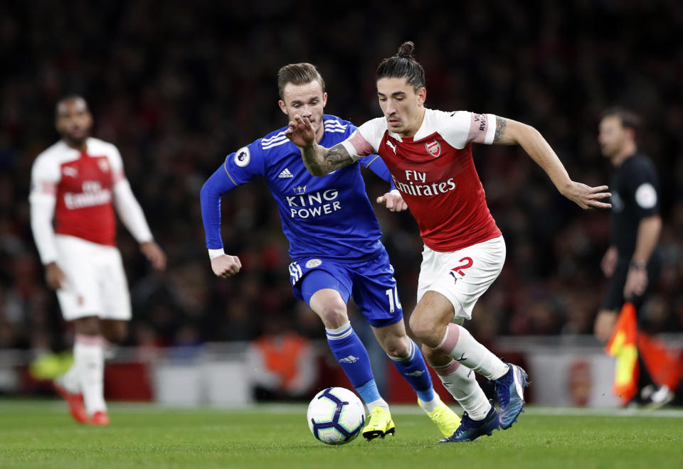 Leicester City's James Madison, left, vies for the ball with Arsenal's Hector Bellerin during the English Premier League soccer match between Arsenal and Leicester City at the Emirates stadium in London, Monday, Oct. 22, 2018. (AP Photo/Alastair Grant)