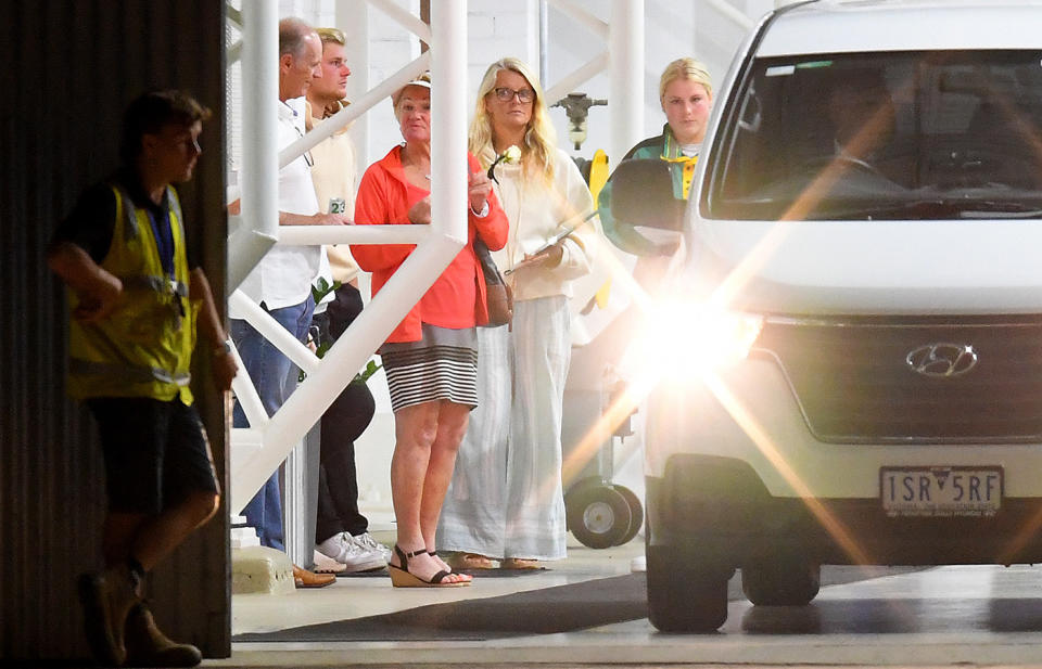 Shane Warne's family, pictured here as a white van exits from a hangar at Melbourne Airport.