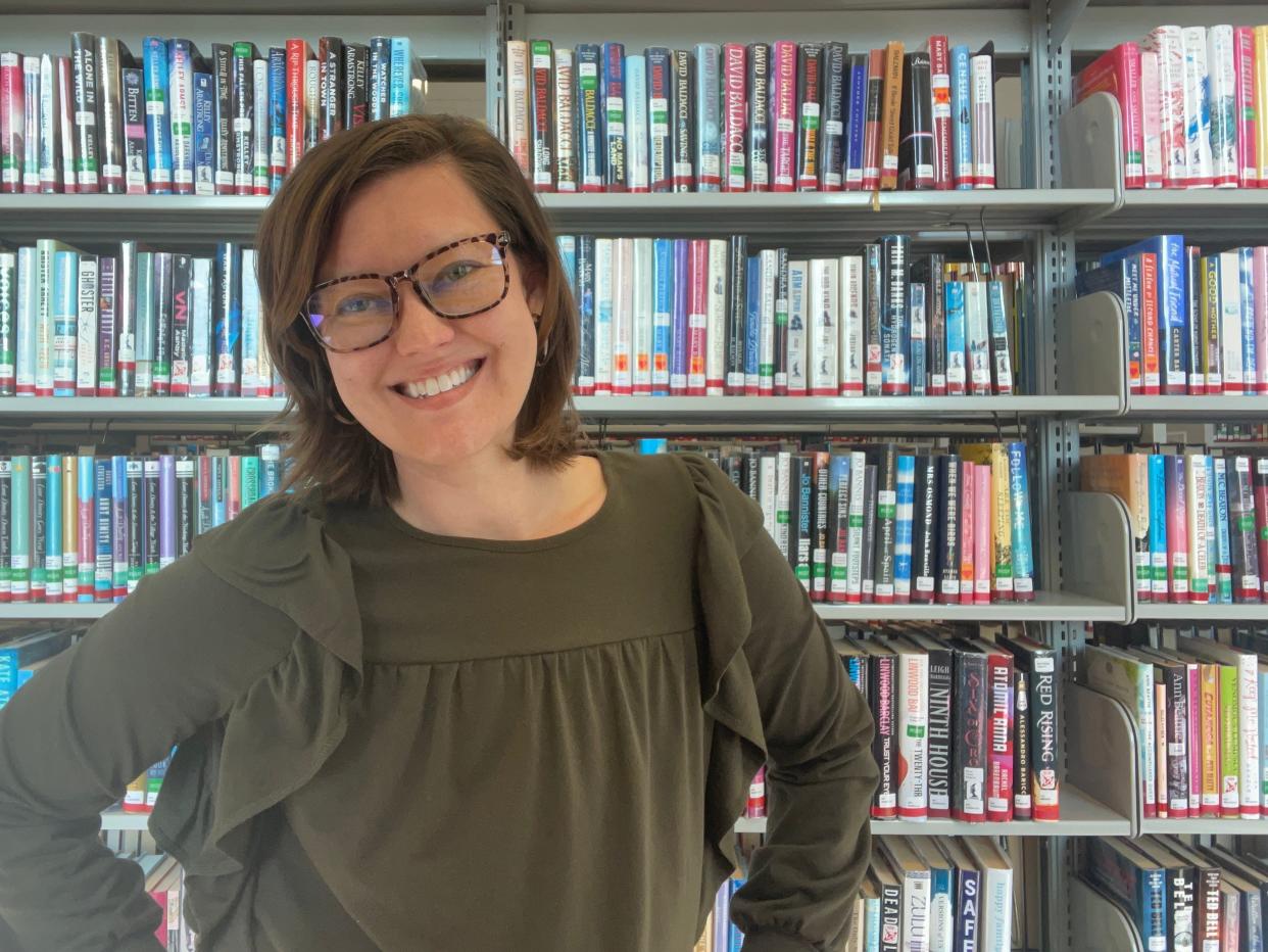 Rachel Garlinghouse standing in front of books