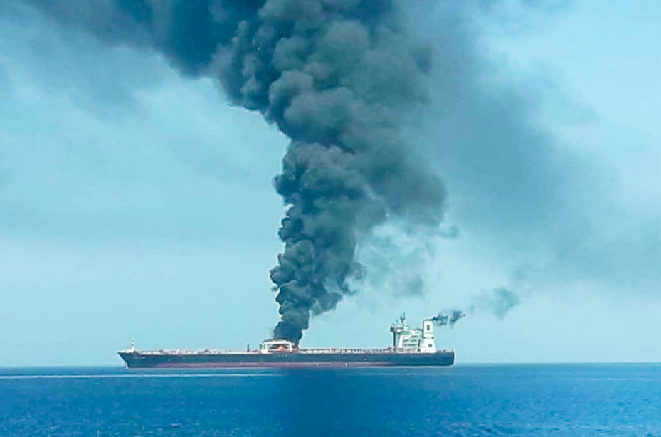 Huge plumes of smoke can be seen billowing from the tanker (Reuters)