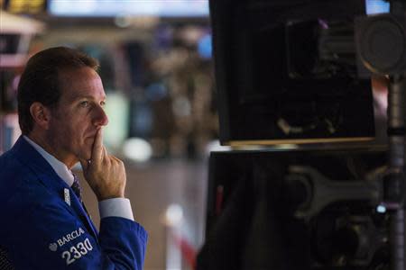 A trader works on the floor of the New York Stock Exchange shortly after the opening of markets in New York, September 4, 2013. REUTERS/Lucas Jackson