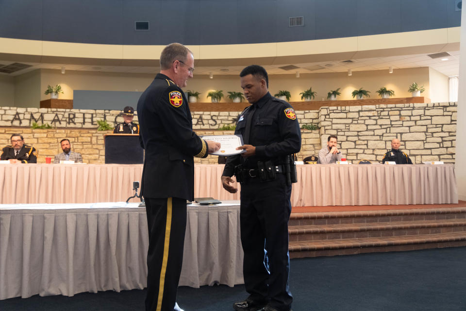 Isaiah Minnieweather received his badge from APD Chief Martin Birkenfeld at the 101st Amarillo Police Academy Graduation Thursday at the Amarillo Civic Center.