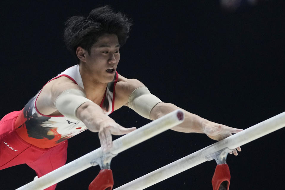 Daiki Hashimoto of Japan competes on the parallel bars at the Men's All-Around Final during the Artistic Gymnastics World Championships at M&S Bank Arena in Liverpool, England, Friday, Nov. 4, 2022. (AP Photo/Thanassis Stavrakis)