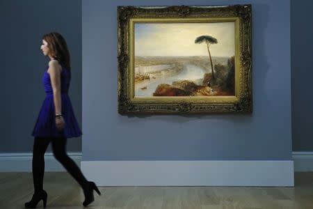 A Sotheby's employee walks near British artist J.M.W. Turner's artwork "Rome, from Mount Aventine" at Sotheby's auction house in London November 28, 2014. Described by auction house Sotheby's as one of the greatest masterpieces of British art still in private hands, Turner's 1835 work "Rome, from Mount Aventine" is estimated to sell for 15-20 million pounds ($23.5 to 31.3 million) when it goes under the hammer on Wednesday. REUTERS/Luke MacGregor (BRITAIN - Tags: SOCIETY BUSINESS)