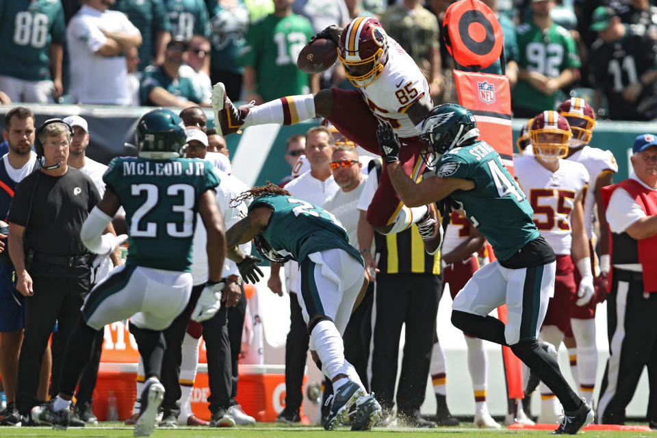 Tight end Vernon Davis #85 of the Washington Redskins leaps over defenders before rushing a reception for a touchdown against the Philadelphia Eagles during the first quarter at Lincoln Financial Field on September 8, 2019 in Philadelphia, Pennsylvania. (Photo by Patrick Smith/Getty Images)