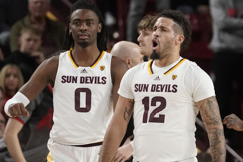 CORRECTS PLAYER AT LEFT TO KAMARI LANDS, INSTEAD OF HUNTER ERICKSON - Arizona State's Jose Perez (12) and Kamari Lands (0) react to a call during the first half of the team's NCAA college basketball game against Utah on Thursday, Jan. 4, 2024, in Tempe, Ariz. (AP Photo/Darryl Webb)