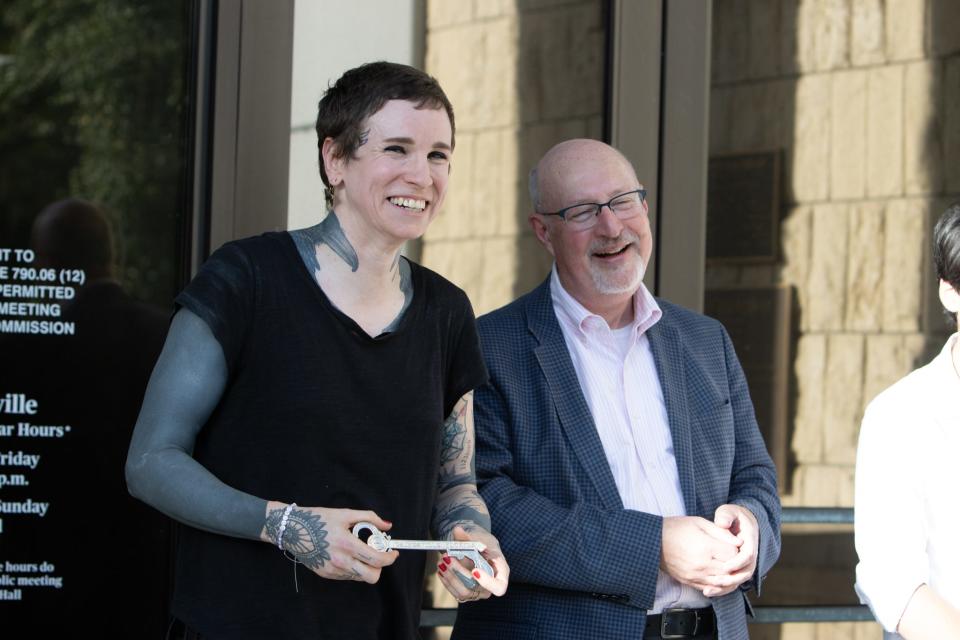 Laura Jane Grace, lead singer of Against Me! stands next to Gainesville Mayor Harvey Ward after receiving the Key to the City on Oct. 27, 2023, in Gainesville, Fla.