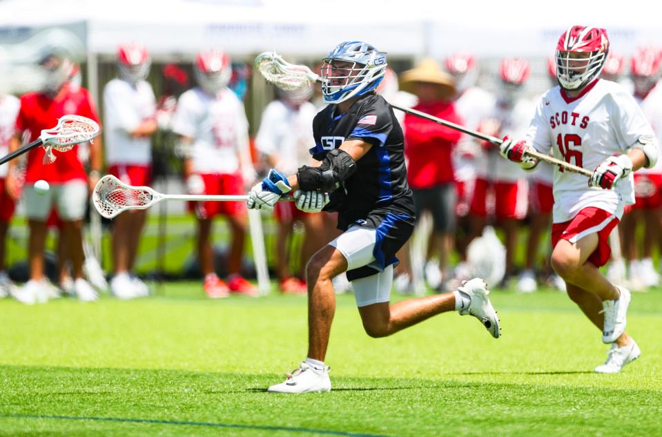 Community School of Naples Seahawks attacker Cal Wyatt (5) shoots and scores during the first quarter of the Class 1A state semifinal against the St. Andrew's Scots at Paradise Coast Sports Complex in Naples on Thursday, May 9, 2024.