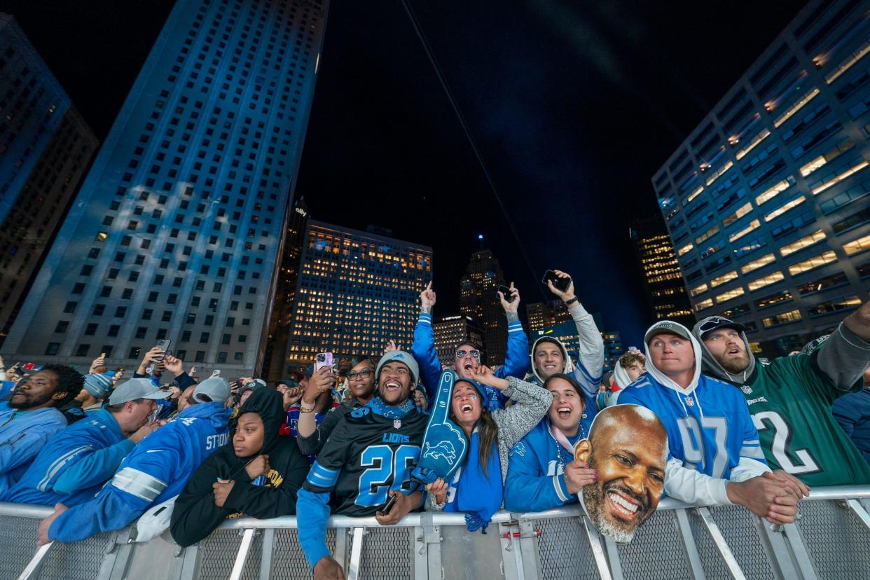 Detroit Lions fans celebrate as Terrion Arnold, from Alabama, is announced as the team's pick.