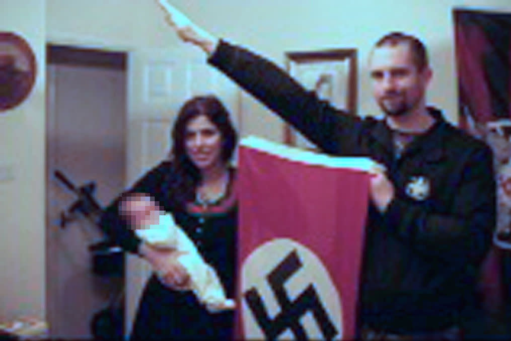 An image shown to the jury of Darren Fletcher, right, who has admitted being a member of banned far-right terrorist group National Action, with alleged member Claudia Patatas and her baby (Picture: PA)