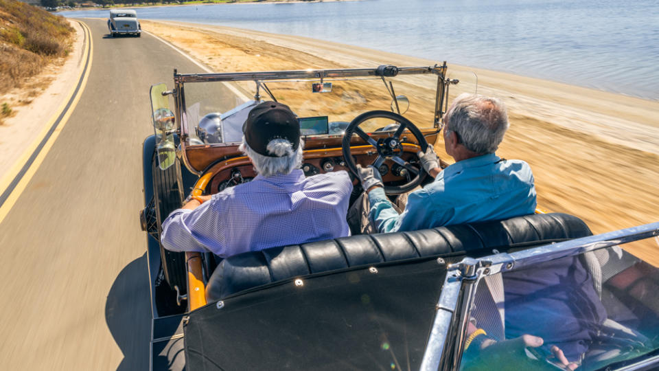 Doug Gates commands the wheel of his 1921 Springfield Silver Ghost as the author listens hard to hear the engine. - Credit: Rolls-Royce Motor Cars NA