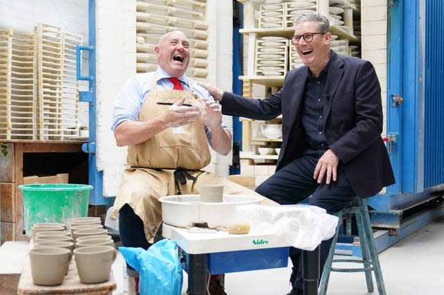 Labour leader Sir Keir Starmer laughing alongside potter Keith Brymer Jones