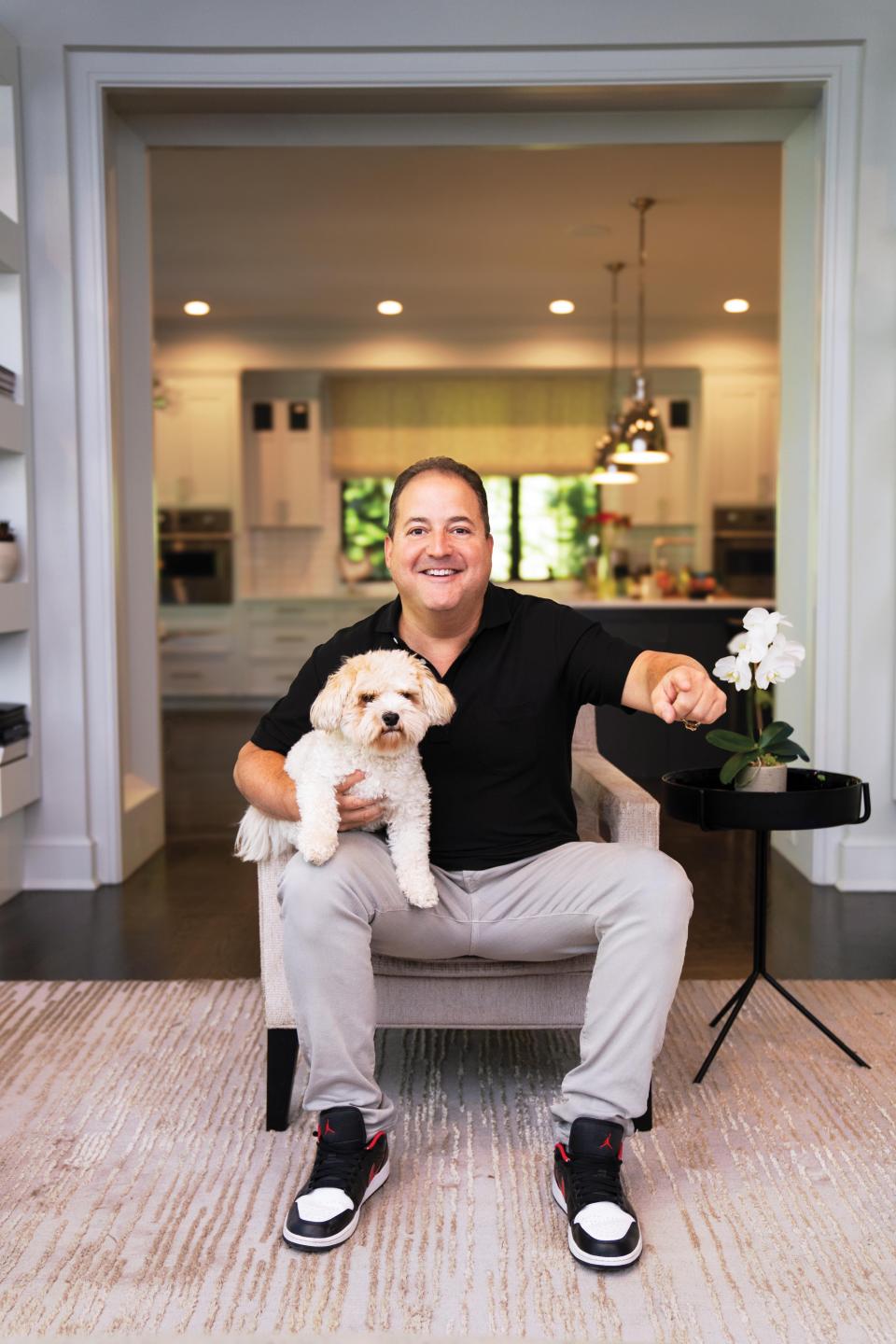 Celebrity chef Josh Capon at his Tenafly home with his dog Cody.