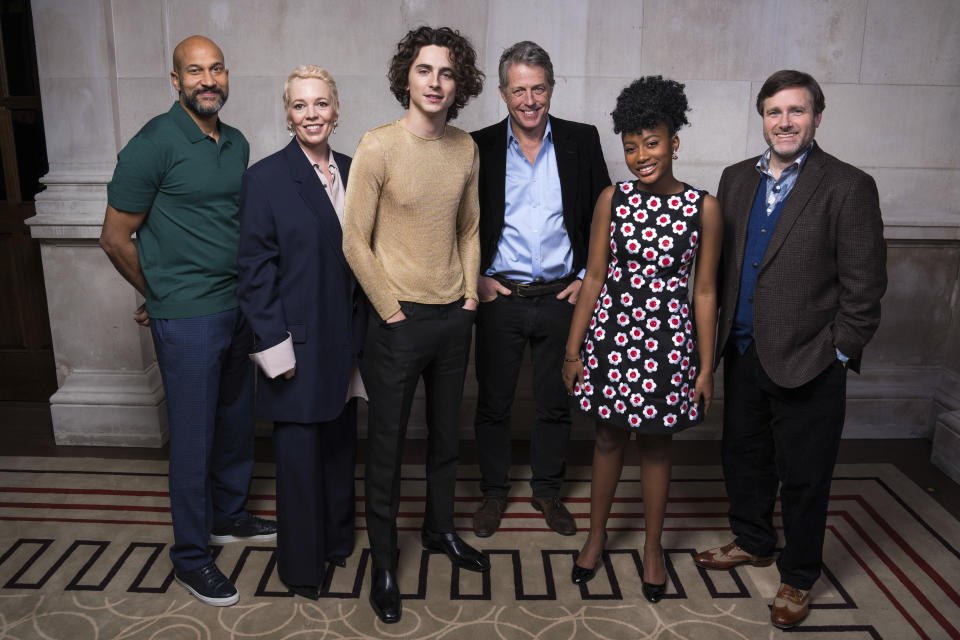 Keegan-Michael Key, from left, Olivia Colman, Timothee Chalamet, Hugh Grant, Calah Lane and director Paul King pose for portrait to promote the film "Wonka" on Wednesday, Nov. 29, 2023 in London. (Scott Garfitt/Invision/AP)