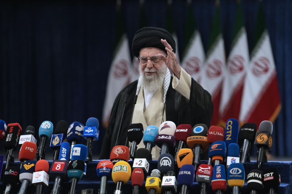 Iranian Supreme Leader Ayatollah Ali Khamenei waves to media after casting his vote during the presidential election in Tehran, Iran, Friday, June 28, 2024. Iranians were voting Friday in a snap election to replace the late President Ebrahim Raisi, killed in a helicopter crash last month, as public apathy has become pervasive in the Islamic Republic after years of economic woes, mass protests and tensions in the Middle East. (AP Photo/Vahid Salemi)