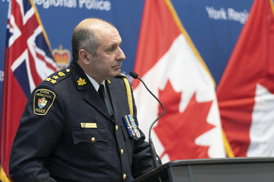 York Regional Police Chief Jim MacSween speaks to the media during a press conference in Aurora, Ontario, on Monday, Dec, 19, 2022. Police say multiple people are dead, including the suspect, after a mass shooting in an apartment building in Vaughan, Ontario. (Arlyn McAdorey/The Canadian Press via AP)