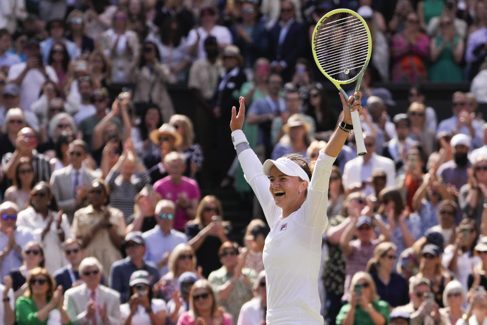 Barbora Krejcikova of the Czech Republic celebrates after defeating Jasmine Paolini of Italy in the women's singles final at the Wimbledon tennis championships in London, Saturday, July 13, 2024. (AP Photo/Alberto Pezzali)