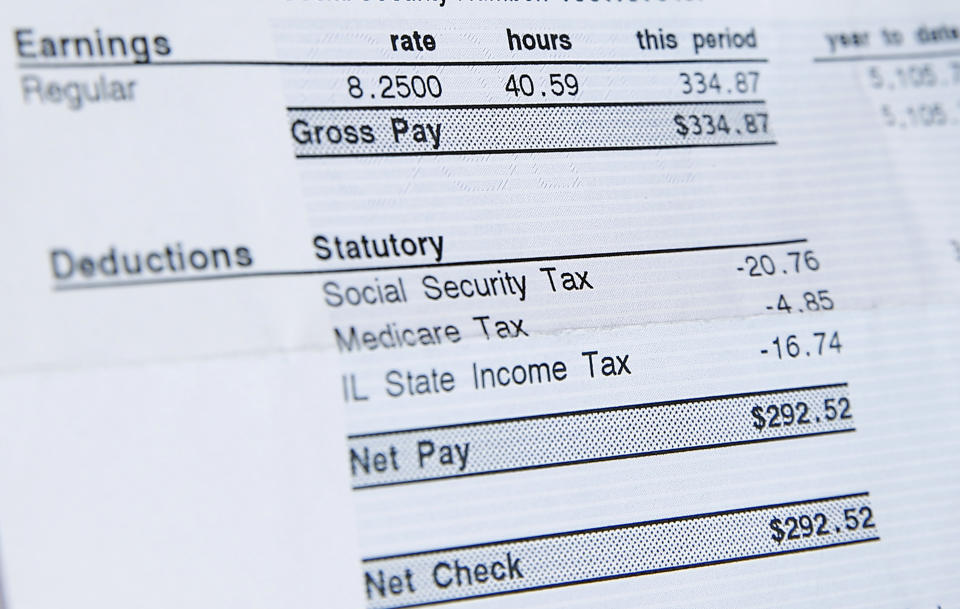 A recent paycheck for Delores Leonard shows her hourly wage of $8.25 for working at a McDonald's Restaurant, the minimum wage in Illinois, in Chicago, Illinois, September 29, 2014. Leonard, a single mother raising two daughters, has been working at McDonald's for seven years and has never made more than minimum wage.  Picture taken September 29, 2014.   REUTERS/Jim Young (UNITED STATES - Tags: BUSINESS EMPLOYMENT)