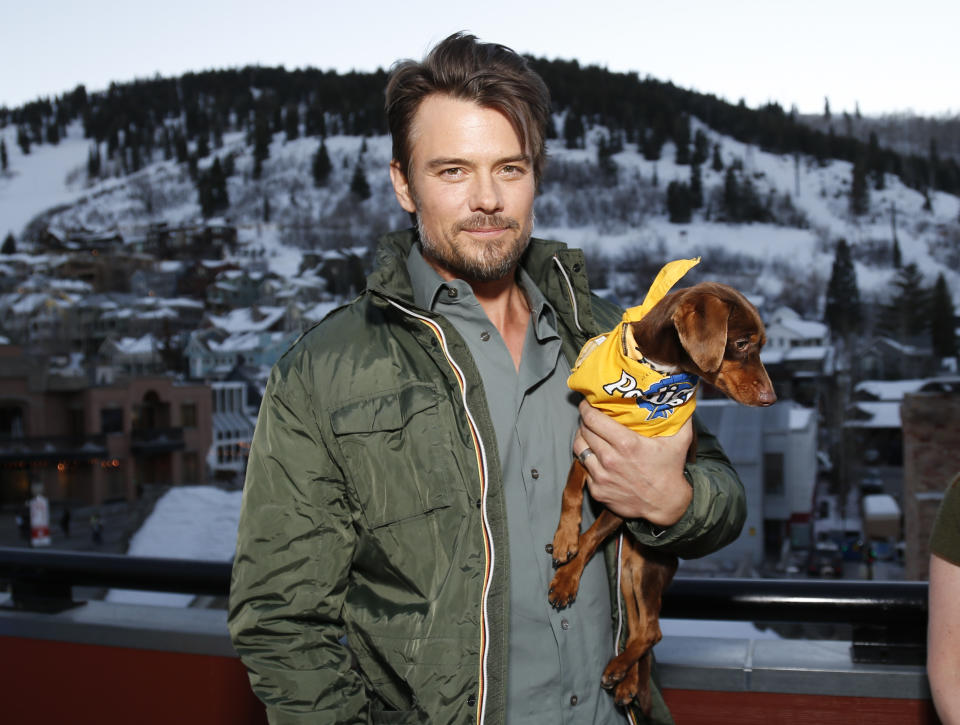 Actor Josh Duhamel poses with a resuce dog named Charlie while he and Boston Red Sox baseball player David Ortiz, not pictured, helps launch Pedigree Brand's "See what good food can do." documentary-style campaign to help shelter dogs during the 2014 Sundance Film Festival, on Monday, Jan. 20, 2014, in Park City, Utah. (Photo by Danny Moloshok/Invision/AP)