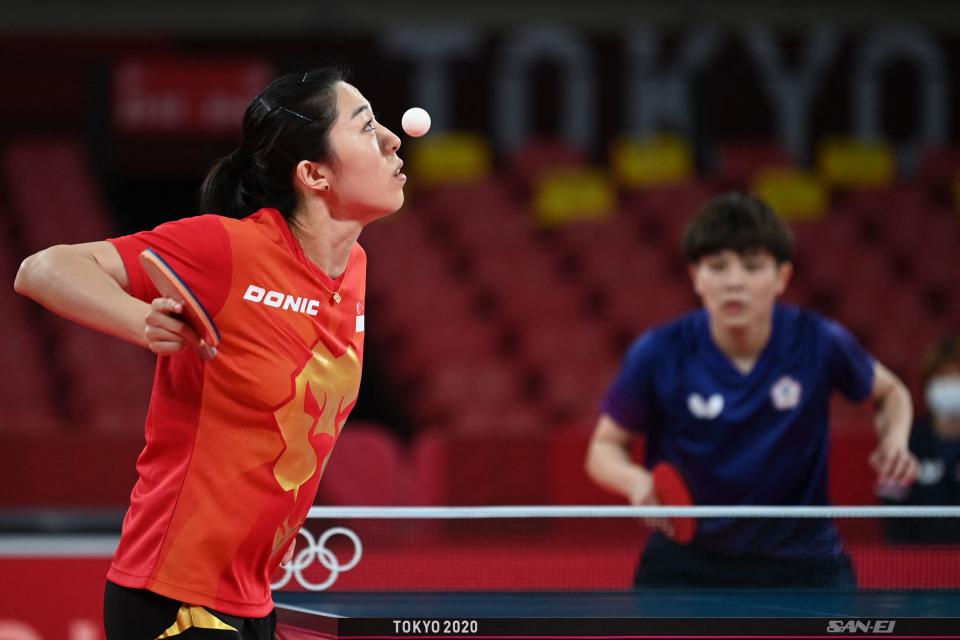 <p>Singapore's Yu MengYu (L) serves to Taiwan's Cheng I-ching during her women's singles round 3 table tennis match at the Tokyo Metropolitan Gymnasium during the Tokyo 2020 Olympic Games in Tokyo on July 27, 2021. (Photo by JUNG Yeon-je / AFP)</p> 