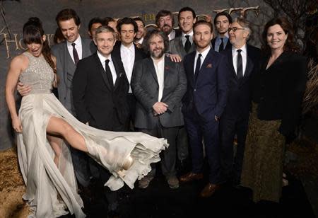 Cast and crew members pose for photographers at the premiere of the film "The Hobbit: The Desolation of Smaug" in Los Angeles December 2, 2013. REUTERS/Phil McCarten