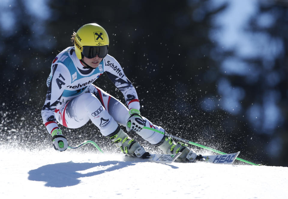 Austria's Anna Fenninger competes on her way to finish in second place, during a women's alpine skiing Super-G at the World Cup finals in Lenzerheide, Switzerland, Thursday, March 13, 2014. (AP Photo/Marco Trovati)