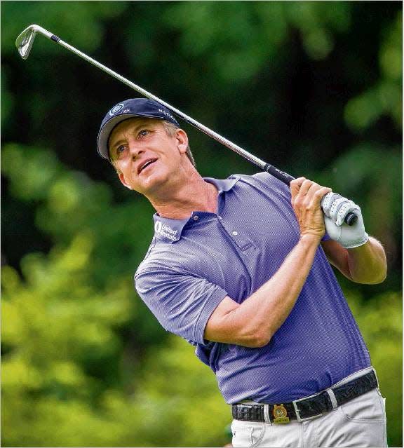 6/28/2019: Tribune Photo/ROBERT FRANKLINDavid Toms tries to put some body English on his shot on hole No. 12 during the opening round of the U.S. Senior Open golf tournament, Thursday at Warren Golf Course in South Bend, Ind.