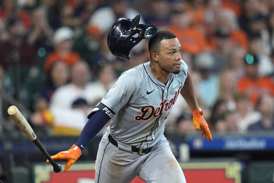 Detroit Tigers' Wenceel Pérez loses his helmet as he hits a single against the Houston Astros during the third inning of a baseball game Saturday, June 15, 2024, in Houston. (AP Photo/David J. Phillip)