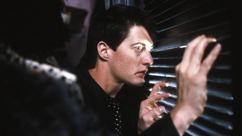 Kyle MacLachlan peers through the closet door in Blue Velvet.