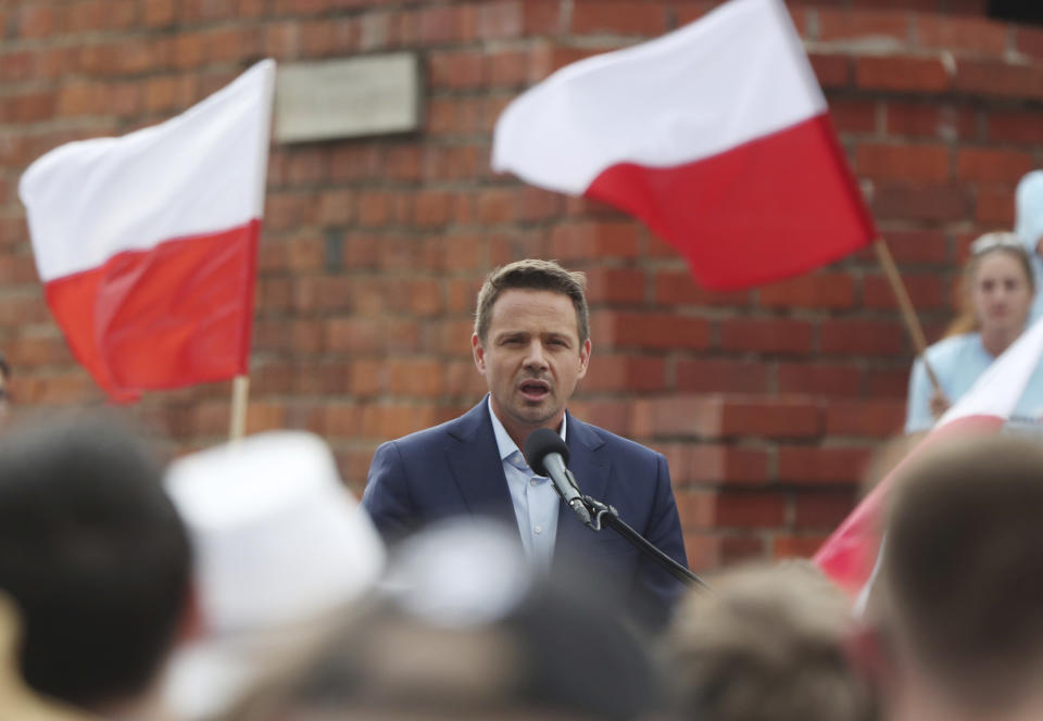 Candidate in Poland's presidential election, Warsaw centrist Mayor Rafal Trzaskowski addresses supporters on the last day of campaigning before Sunday's vote, in Castle Square in Warsaw, Poland, on Friday, June 26, 2020. Trzaskowski is a major challenger to incumbent conservative President Andrzej Duda who is seeking a second five-year term and is leading in the polls. (AP Photo/Czarek Sokolowski)