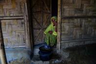 Asara Begum with the cooking pot she took with her when Rakhine state exploded in violence, thinking firstly of how she would feed her children and grandchildren