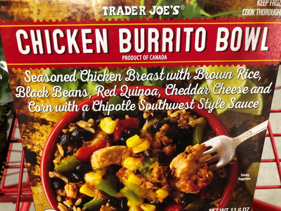 A Trader Joe's chicken-burrito bowl in a box. The meal includes seasoned-chicken breast with brown rice, black beans, red quinoa, cheddar cheese, and corn with a chipotle southwest-style sauce. 