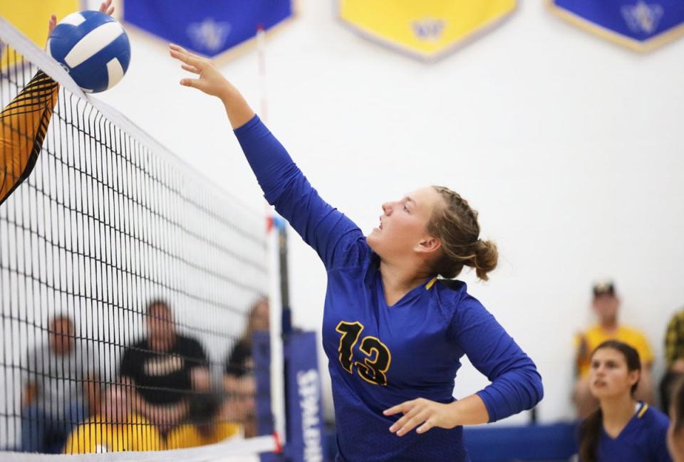 Wapello’s Montana Boline hits the ball over the net in their SEISC North Division win over Lone Tree.