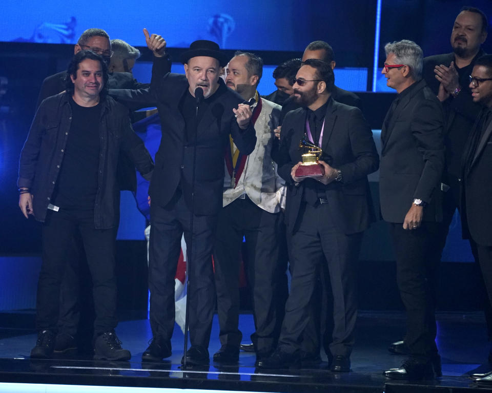 Ruben Blades, second from left, Roberto Delgado, third from left and his orchestra accept the award for album of the year for "Salswing!" at the 22nd annual Latin Grammy Awards on Thursday, Nov. 18, 2021, at the MGM Grand Garden Arena in Las Vegas. (AP Photo/Chris Pizzello)