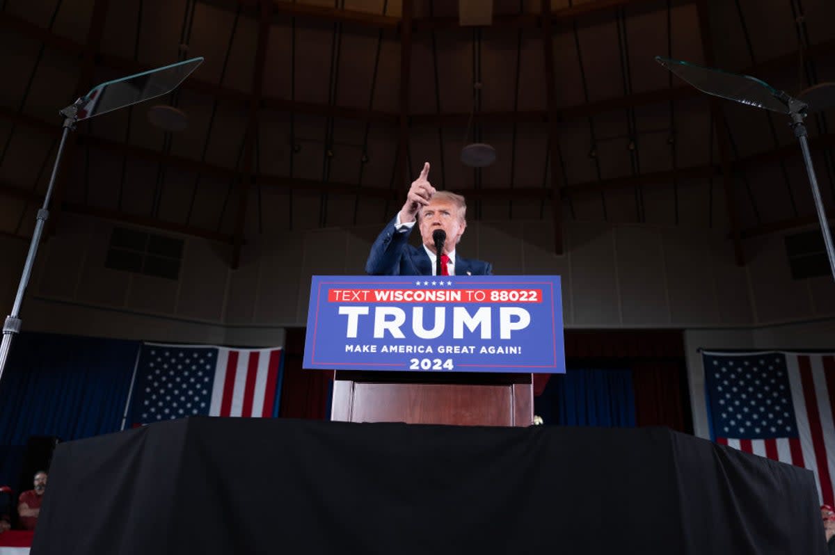 Republican presidential candidate Donald Trump speaks to guests during a rally on 1 May 2024 in Waukesha, Wisconsin. A recent poll has Trump and President Joe Biden currently tied in the state (Getty Images)