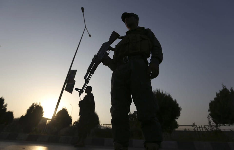 Afghan security forces stand guard