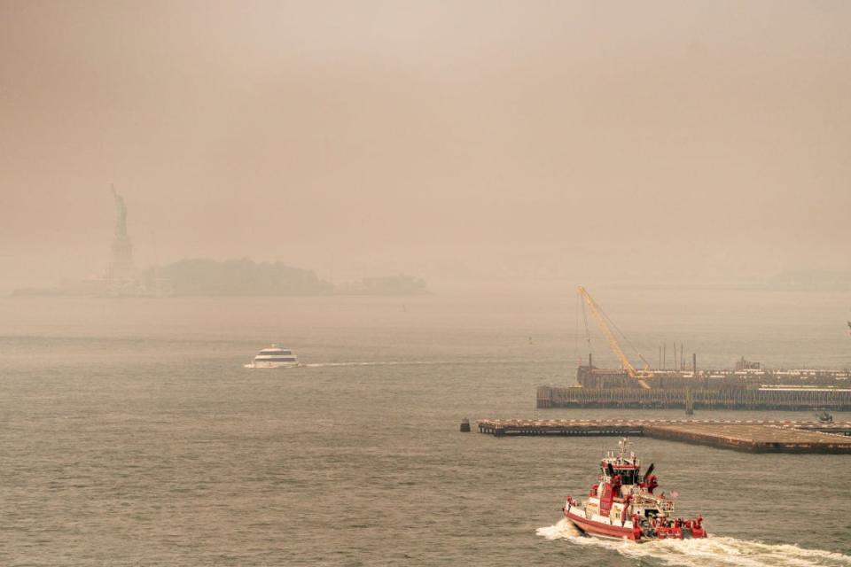 Smoke from wildfires in Canada shrouds the Statue of Liberty on June 30, 2023 in New York City (Getty Images)