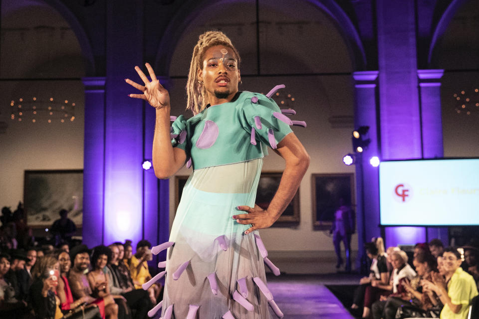 The Claire Fleury collection is modeled during the dapperQ fashion show at the Brooklyn Museum on Thursday Sept. 5, 2019, in New York. (AP Photo/Jeenah Moon)