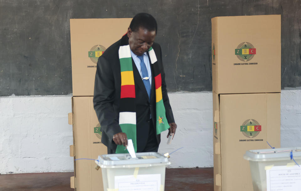 Zimbabwean President Emmerson Mnangagwa casts his vote at a polling station in Kwekwe, Zimbabwe, Wednesday, Aug. 23, 2023. Polls have opened in Zimbabwe as President Emmerson Mnangagwa seeks a second and final term in a country with a history of violent and disputed votes. (AP Photo)